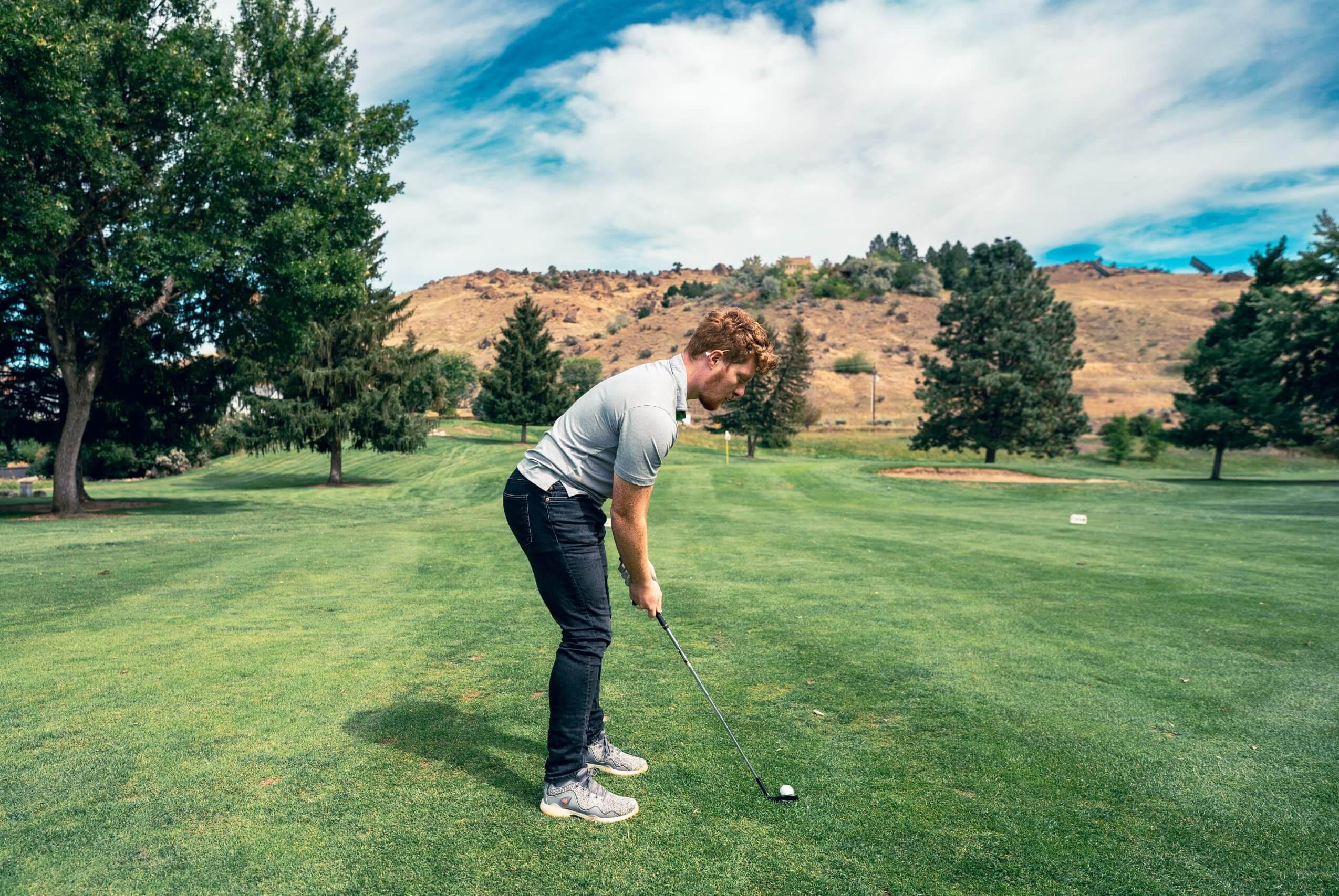 Golifing in Idaho during sunny summer weather on scenic golf course